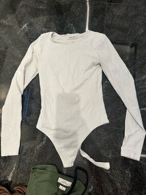 Babaton White Long Sleeve One-Piece Bodysuit